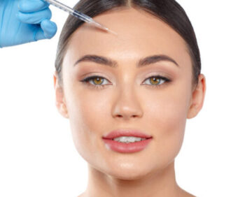 Portrait of an attractive young woman receiving botox treatment.